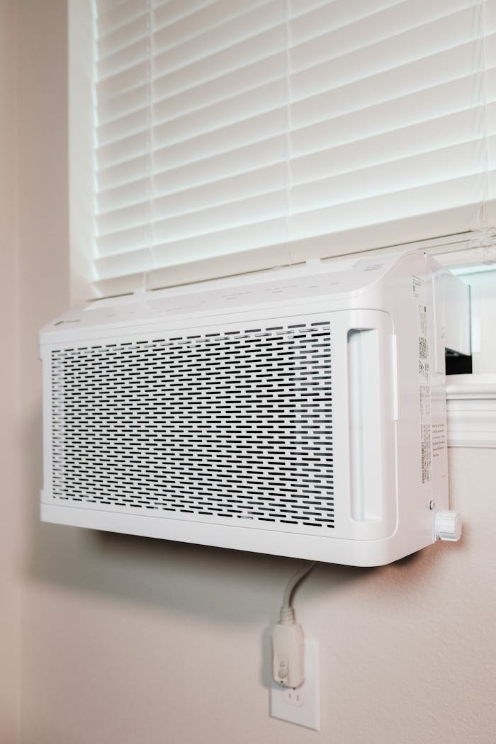 Wall-mounted air conditioner installed in a residential setting, providing cooling comfort.